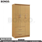 A traditional three-door wardrobe with a light oak Water Resistant Strong Laminated Board finish and silver handles. The upper section consists of a pair of doors on the left and a single, lockable door on the right. Below the left doors is a stack of two wide drawers, the top of which is also lockable. The wardrobe is shown against a white background.